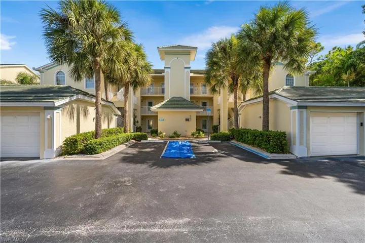 View of property. 1 car assigned garage.