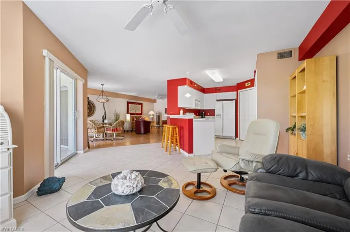 Another seating area or it can be used as an office.  Tile floors.