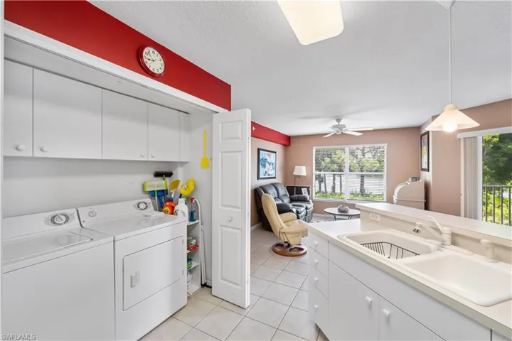 Washroom with independent washer and dryer. Extra storage.