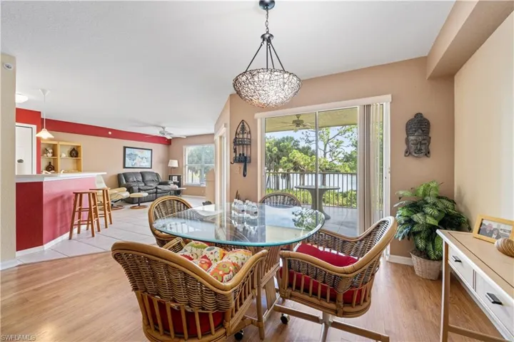Dining area featuring notable chandelier and light wood-type flooring