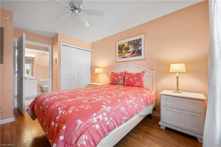 2nd Bedroom featuring ensuite bath, ceiling fan, hardwood / wood-style flooring, and a closet. Ensuite bath.