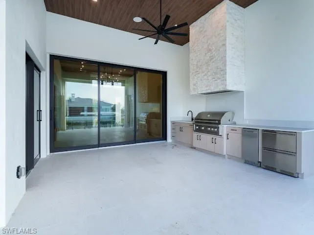 View of patio / terrace featuring ceiling fan and area for grilling