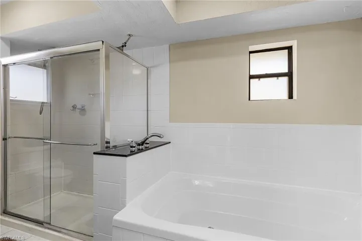 Bathroom with plus walk in shower