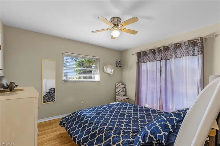 Bedroom featuring ceiling fan and light hardwood / wood-style floors