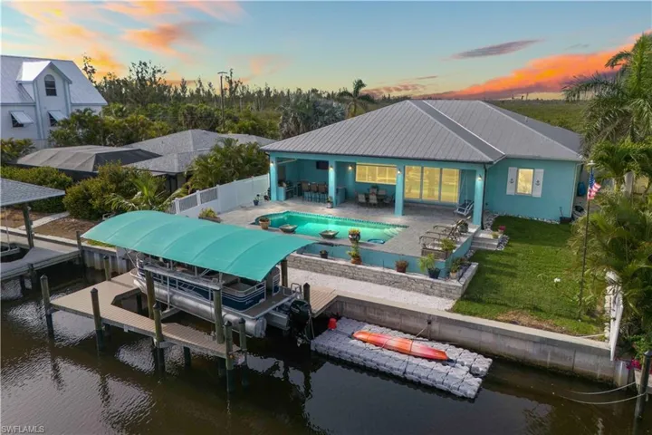 The dock is a charming, functional feature that extends into the calm waters of the canal, offering a private and serene spot to enjoy the outdoors.
