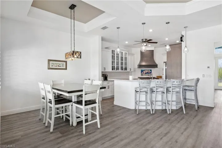 The open layout allows easy access to the kitchen, with a natural flow between both areas, making it ideal for meal prep and serving.