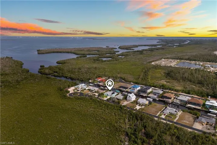 It’s a peaceful, breathtaking scene that perfectly blends natural beauty with serene waterfront living.