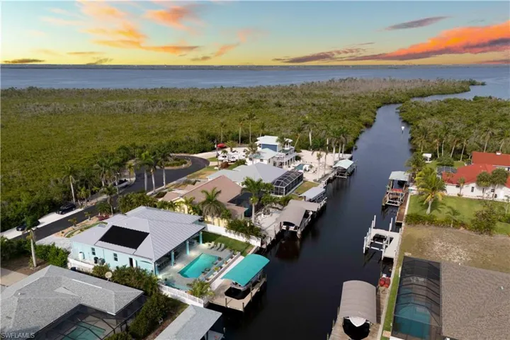 The calm waterway provides an easy route to the Gulf, making it a perfect spot for boating, water sports, or simply enjoying the stunning waterfront views.