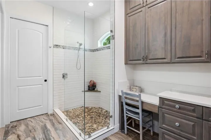 Extensive custom cabinetry with multiple drawers, built-ins, and a large linen closet—perfect for keeping all your essentials neatly organized.