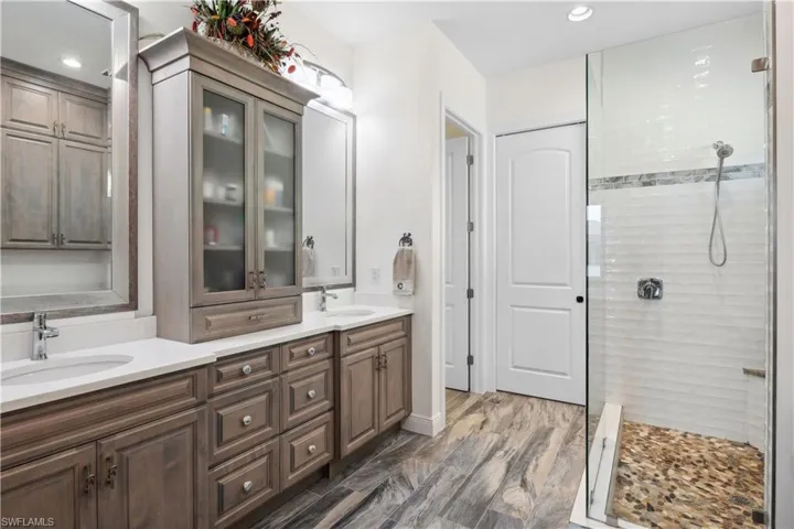 Step into luxury in this spacious primary bathroom, featuring a HUGE walk-in shower.