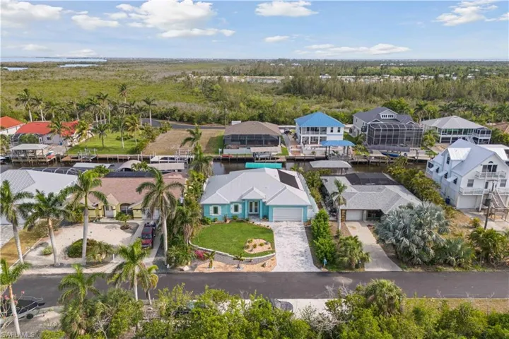 The clear, winding waterway connects you to endless boating, fishing, and adventure, all while surrounded by lush greenery and serene waterfront homes.
