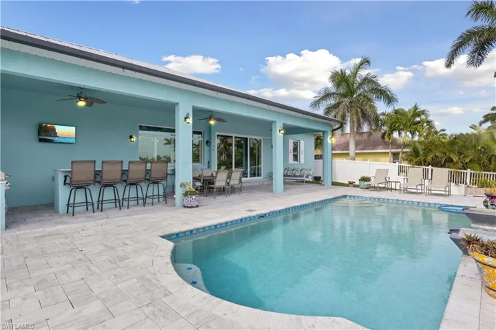 Seamlessly blending comfort and functionality, the pool and lanai area is an entertainer’s dream!