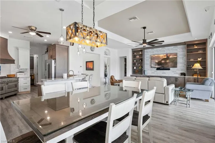 The soft glow of chandelier adds warmth to the space, creating a cozy, intimate ambiance for both family meals and entertaining guests.