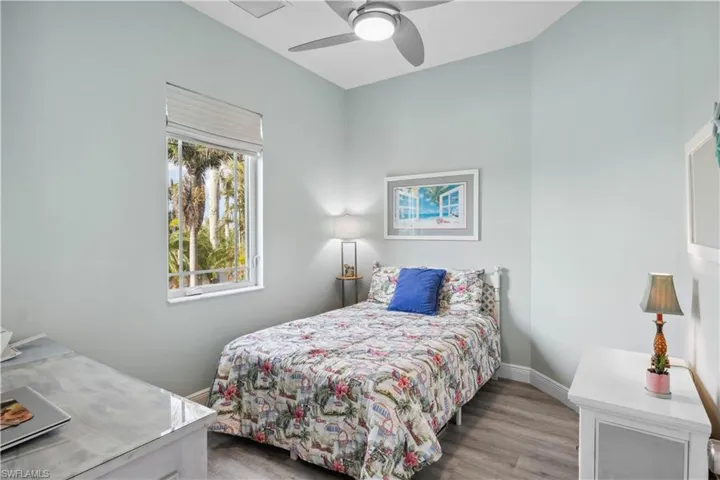 The third bedroom is a bright, comfortable space with a large window.