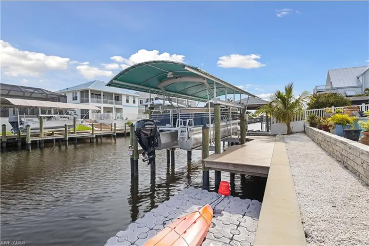 The private dock is built for both durability and convenience, equipped with a 10,000 lb boat lift.