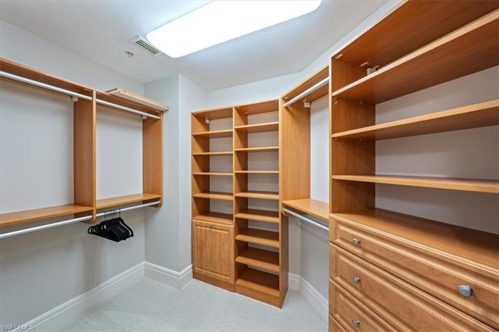 The smaller of the 2 primary suite closets