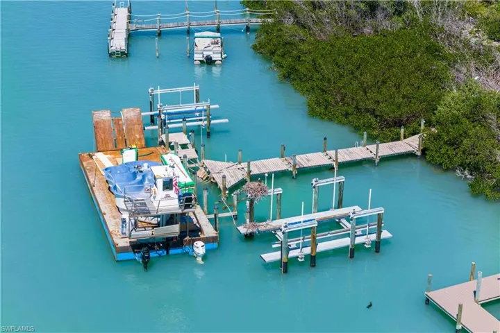 Deep water access and large enough to land a large barge - the property had two large boatlifts and easy access for additional boat parking!