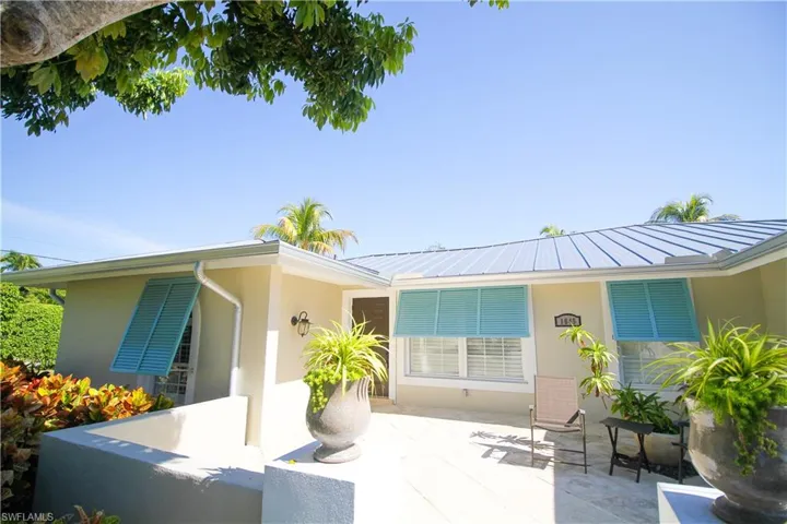 Back of property featuring stucco siding
