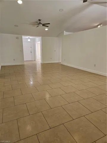 Recessed Lighting, 2 modern ceiling fans with lights, baseboards and tile flooring throughout.