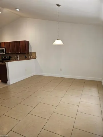 View into the great room from the 12x12 breakfast area. Lots of natural lighting in this home in addition to the overhead lighting.