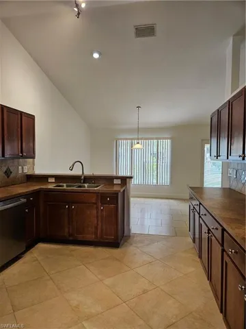 High ceilings and modern lighting fixture in the kitchen