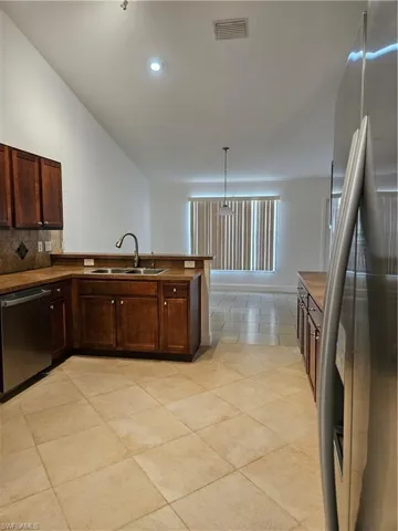 This is a perfect kitchen for someone who loves to cook and bake as there is tons of scabinet storage as well as countertop space for prepping meals.