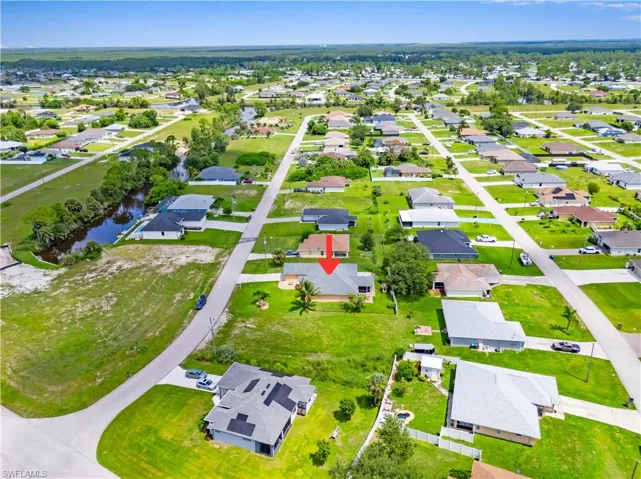 View of property location with nearby suburban area