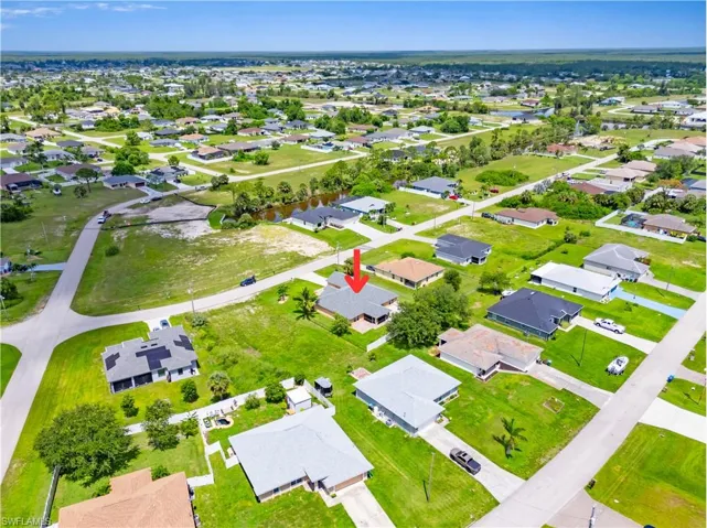 Aerial overview of property's location featuring nearby suburban area