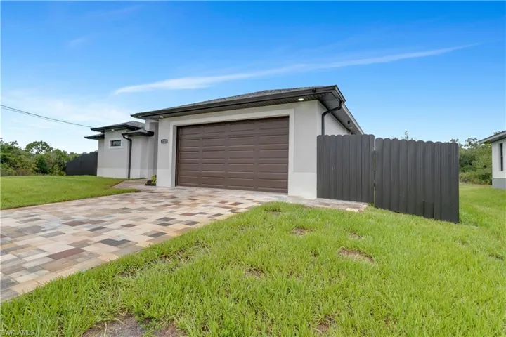 Garage with a lawn