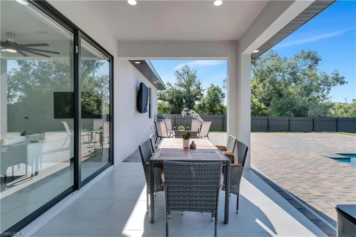 View of patio featuring ceiling fan