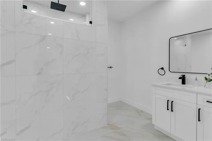 Bathroom with vanity and tile patterned flooring