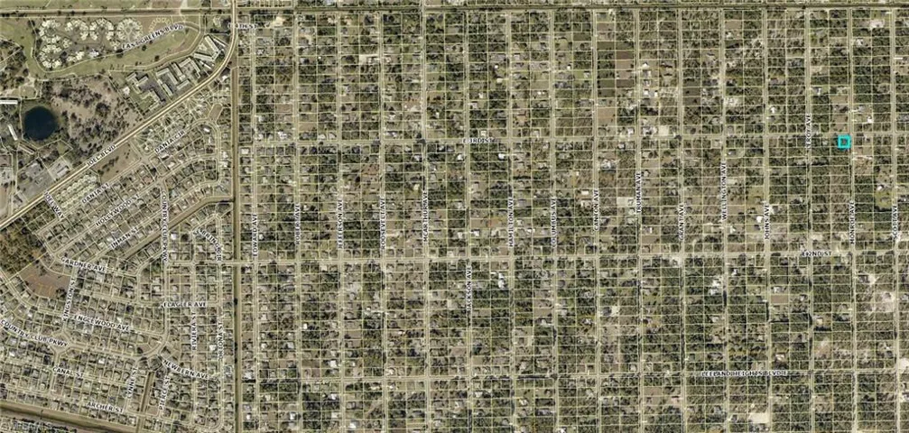 Aerial Map. Depicting a grid-based urban layout with a specific property highlighted