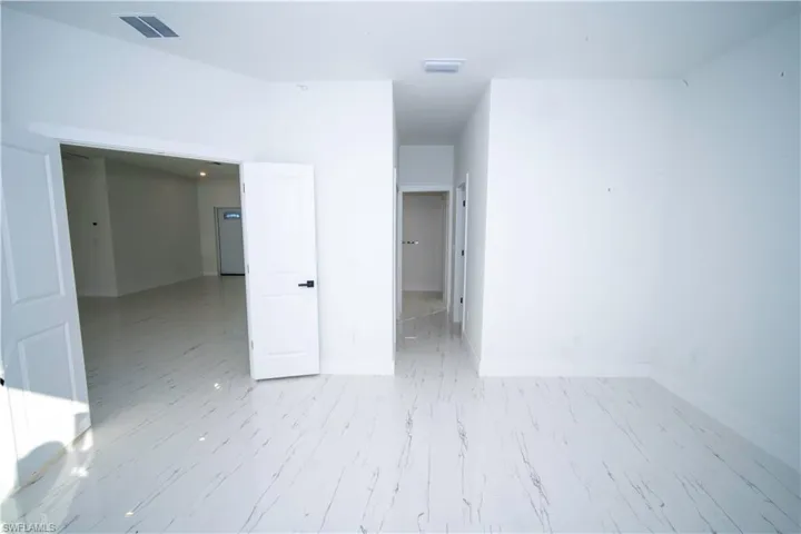 Unfurnished room featuring baseboards