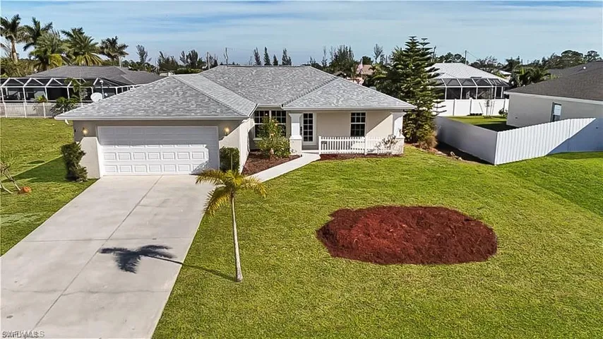 Ranch-style house with concrete driveway, stucco siding, roof with shingles, a garage, and covered porch
