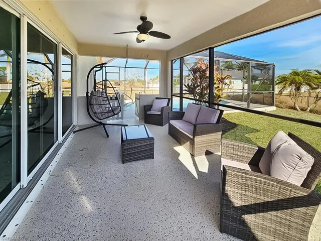 Sunroom featuring ceiling fan and outdoor lounge area