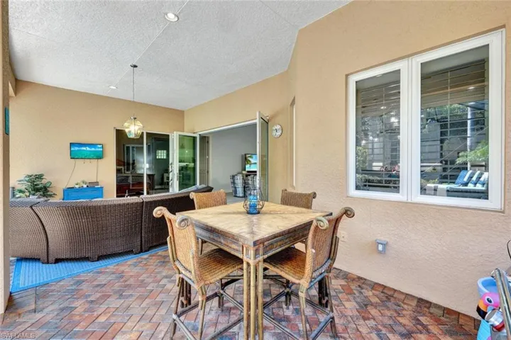 Extended covered lanai with hurricane impact shutters.