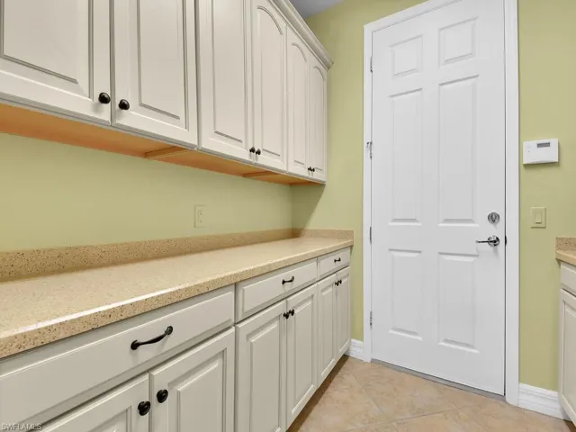 Laundry Room w/ Folding Station & Storage