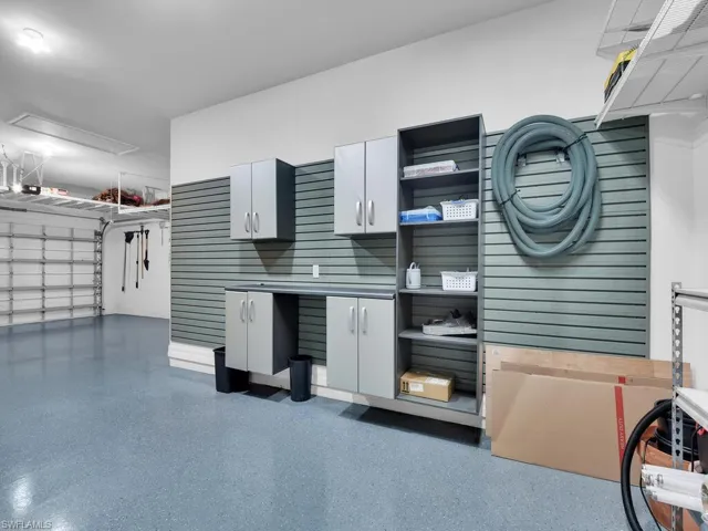 Custom Storage System In Garage, 4 Hanging Racks, & Carpeted Attic w/ Pull-Down Stairs