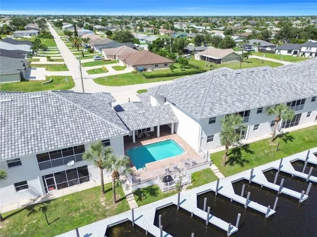 View of subject property with a pool