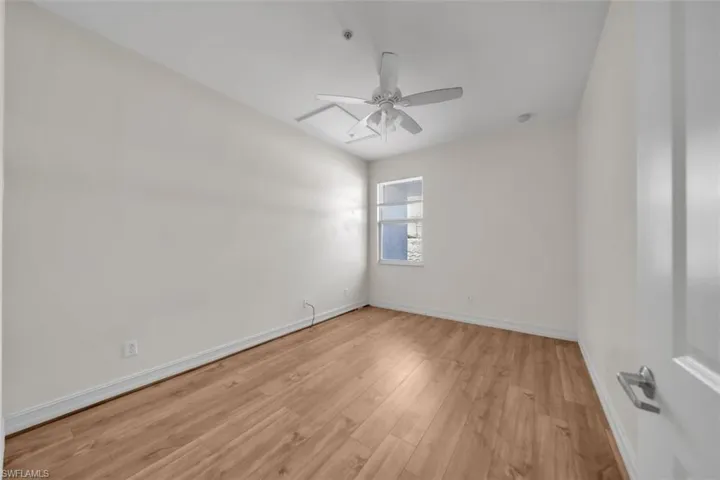 Unfurnished room featuring light wood-style flooring and ceiling fan