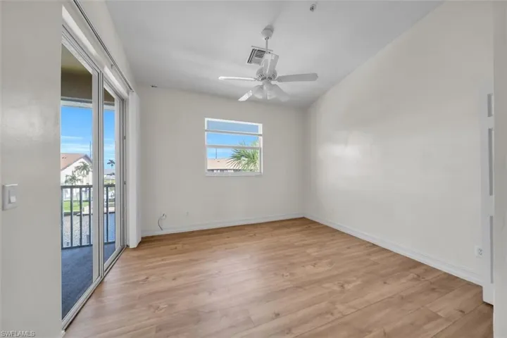 Empty room featuring light wood-style floors and ceiling fan