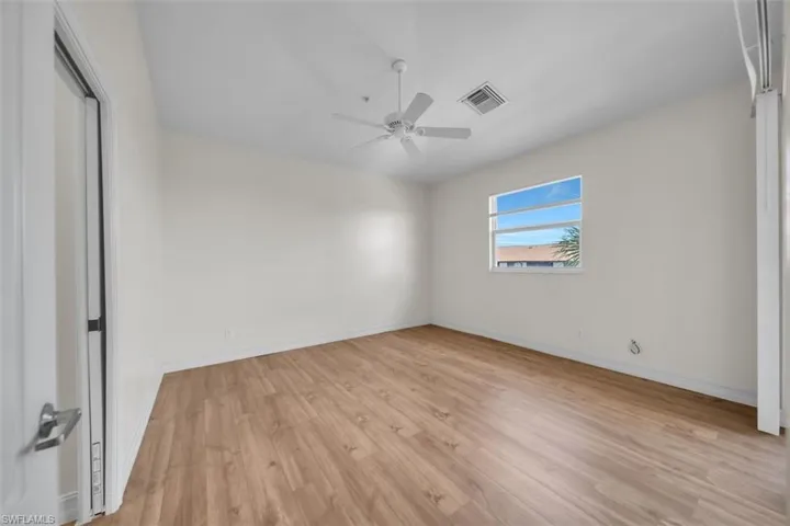Unfurnished bedroom with light wood-type flooring and ceiling fan