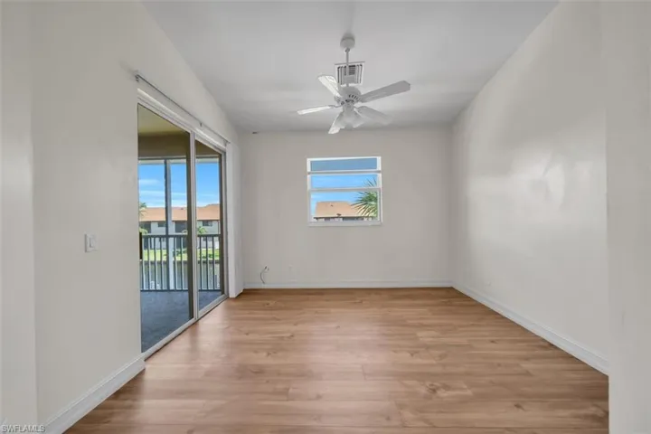 Spare room featuring light wood-style flooring and a ceiling fan
