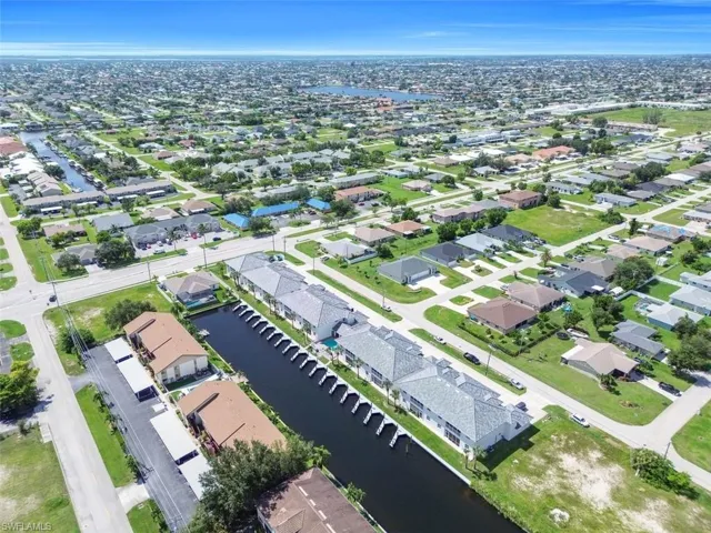 View of property location with a nearby body of water and nearby suburban area