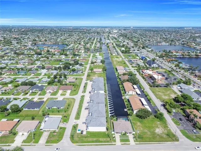 View of property location with nearby suburban area and a large body of water