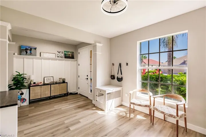 Mudroom with light hardwood / wood-style floors
