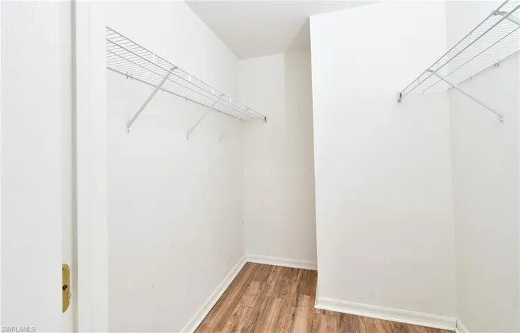 Walk in closet in master bedroom.