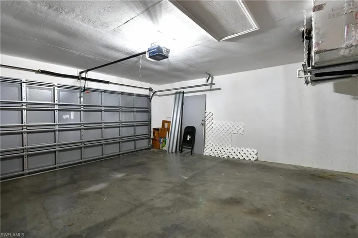 2 car garage. Extra flooring and hurricane shutters.