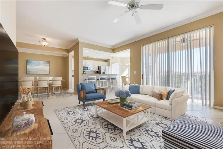 Virtually Staged: Living room featuring ceiling fan, light tile patterned floors, and crown molding