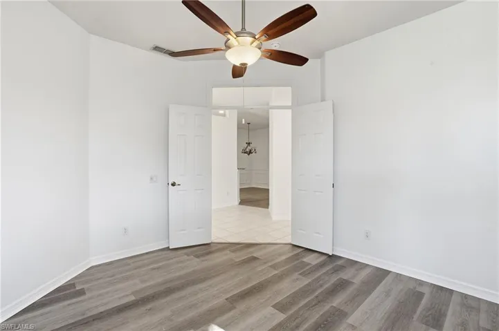 Unfurnished bedroom with light wood-style flooring and a ceiling fan